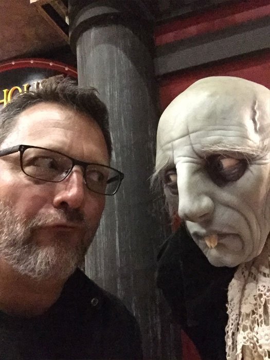 Steve Blum with creature statue at Sideshow Collectibles