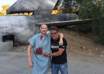 Steve Blum with Bobby Campbell bloodied up for the Take It Back music video on set