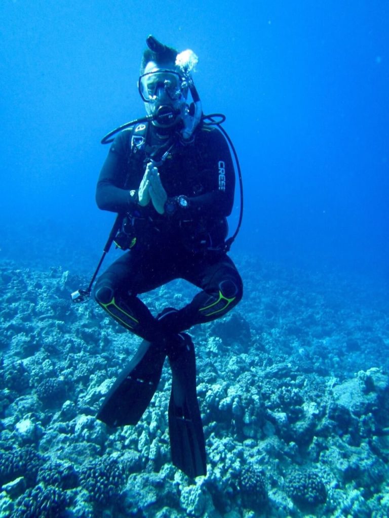 Steve scuba diving in a meditative pose