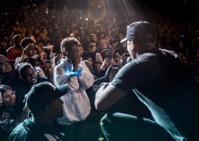 Logic talks to a young fan in the audience at his concert