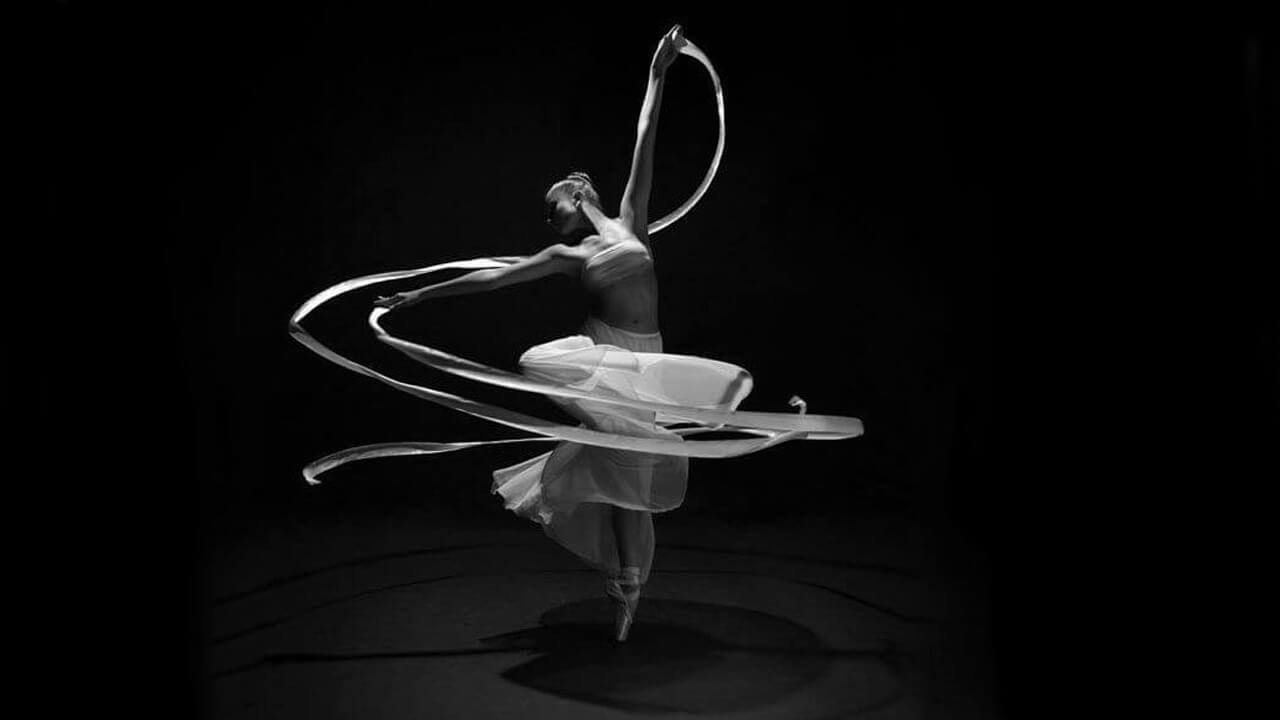 Black and White image of Ballet Dancer spinning with ribbon