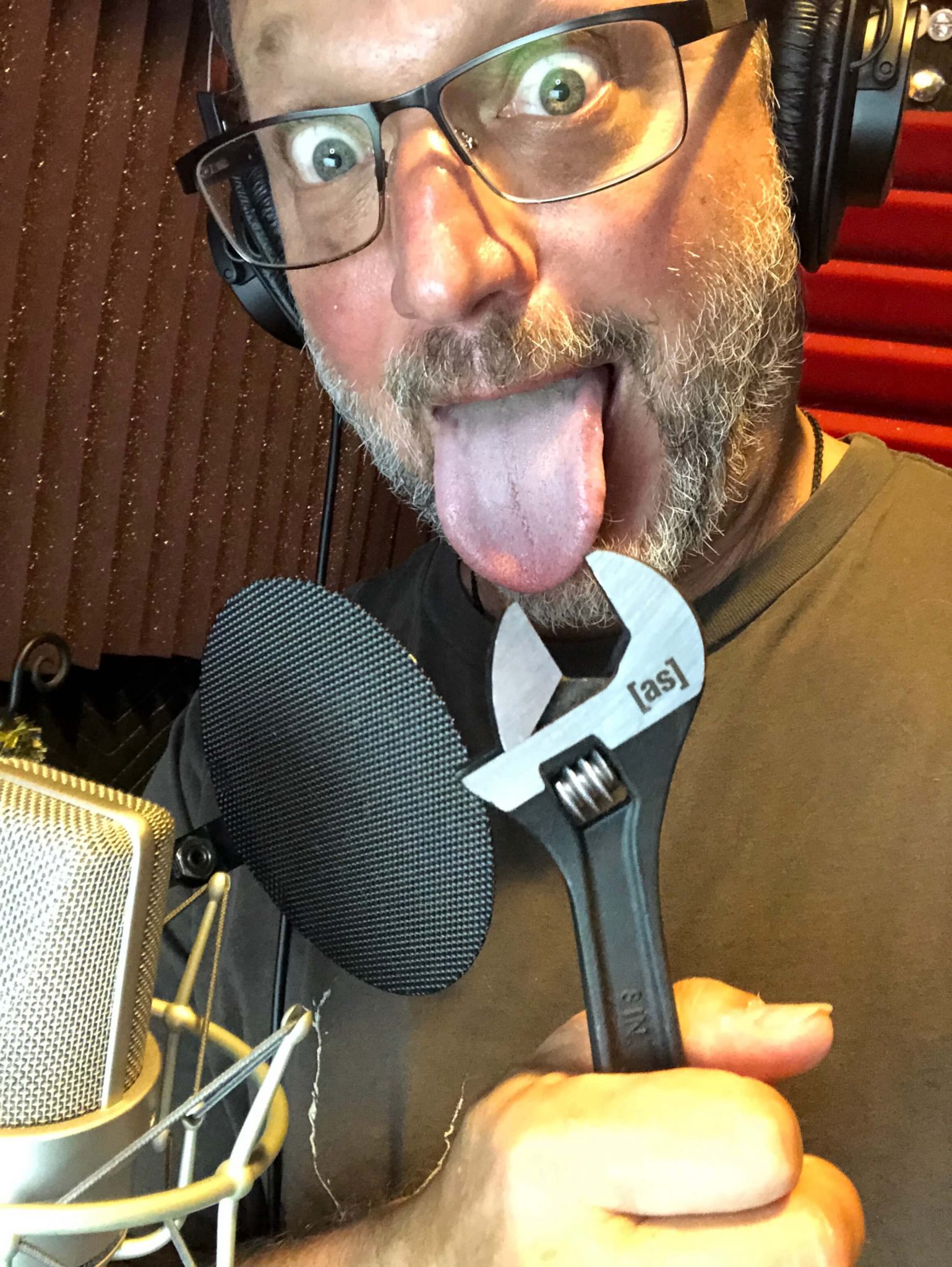 Whats in Your Voiceover Toolbox- Steve Blum holding a wrench with his tongue sticking out