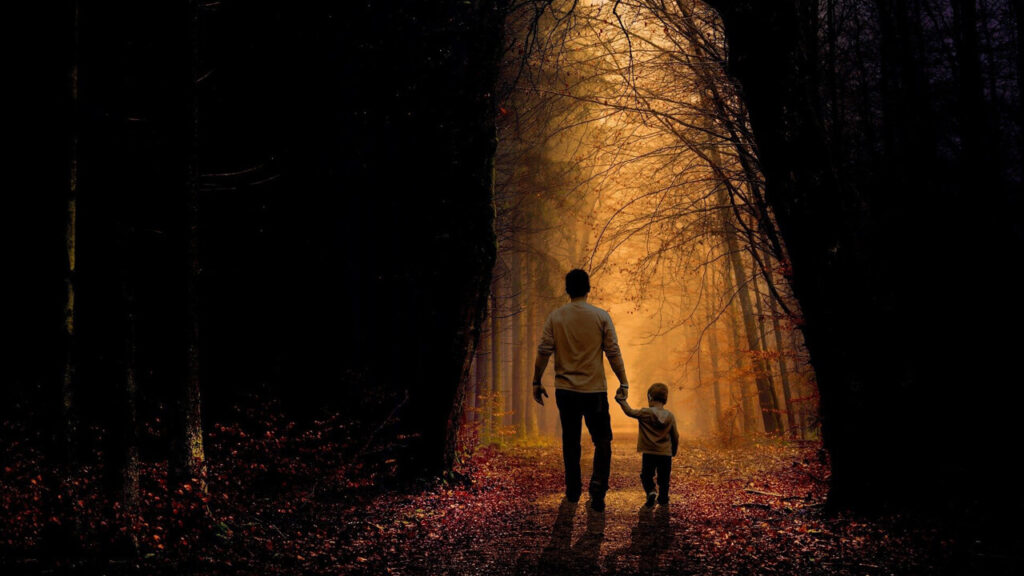 Dad and Son walking through Forest