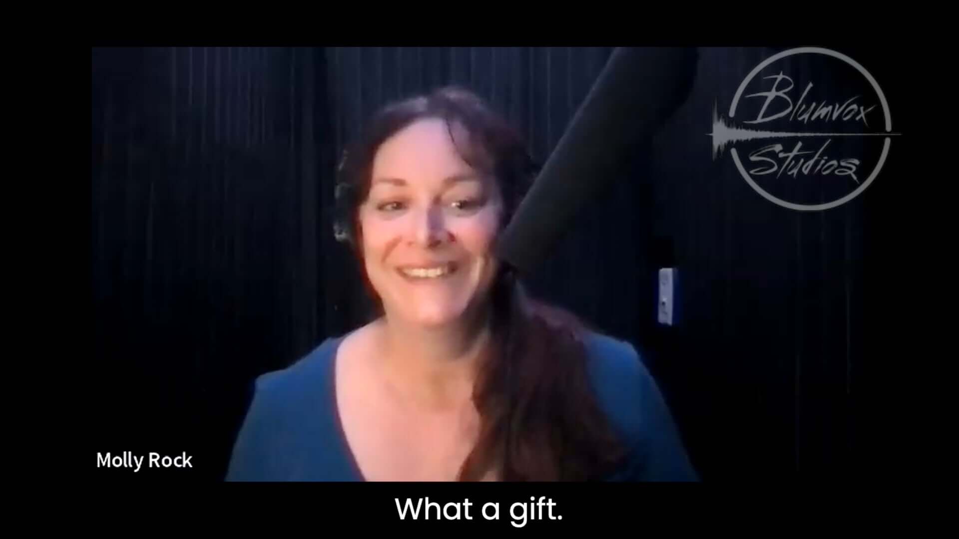 Black background image featuring the face of Blumvox Studios student Molly Rock with the caption "What a gift"